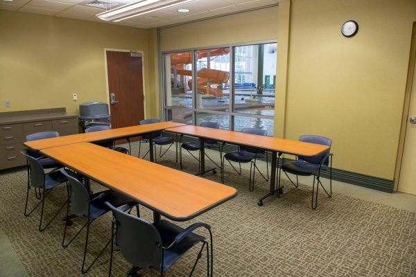 birthday room with tables arranged in a C shape.