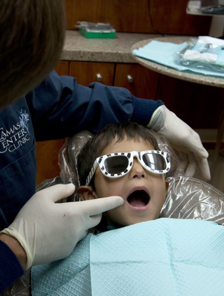 a young child receiving a dental treatment